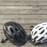 two bicycle helmet color black and white