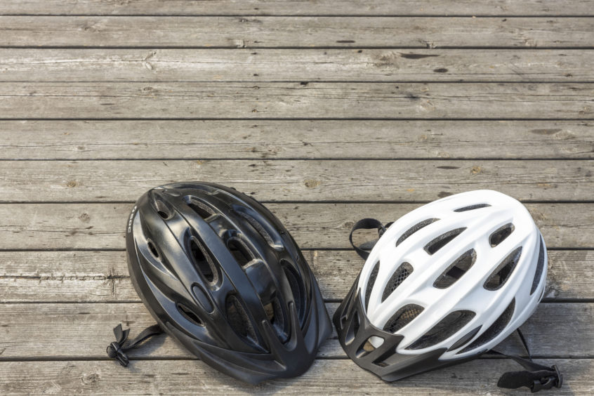 two bicycle helmet color black and white