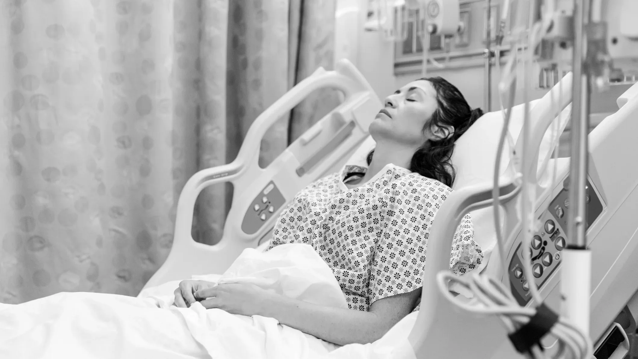 woman lying in hospital bed